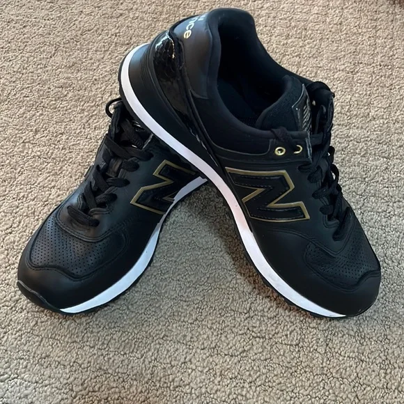 New Balance 584 athletic shoes, Black Leather with Gold accents, Size